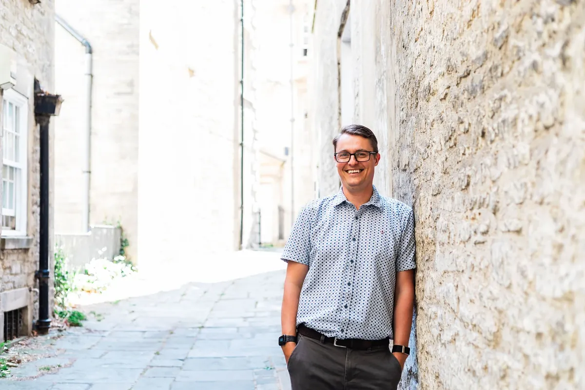 Paul Green smiling in a Bath street