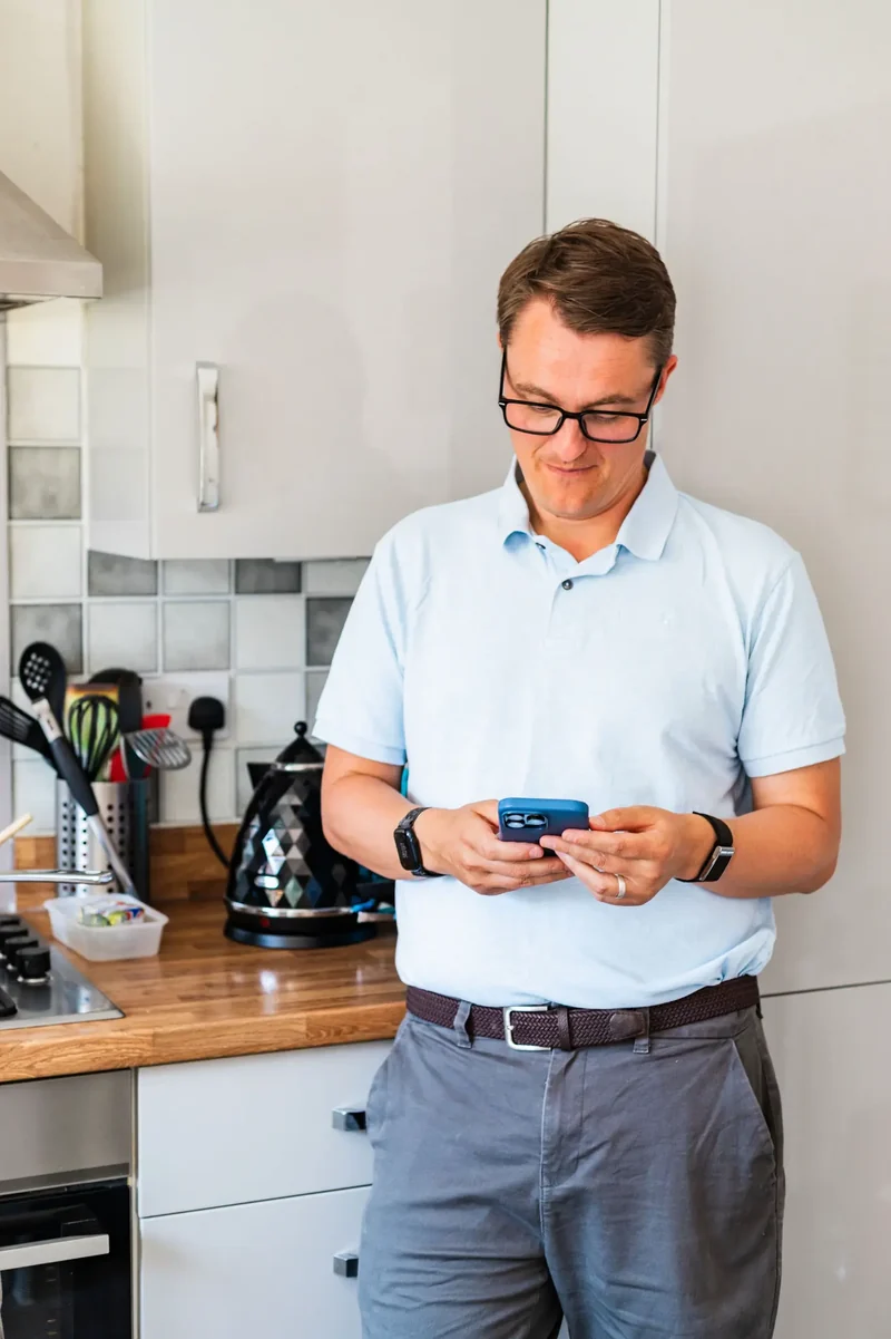 Paul Green using WhatsApp on a phone
